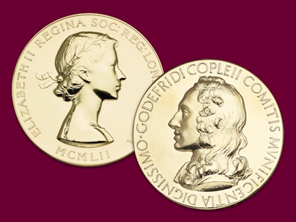 2 coins on a plain background