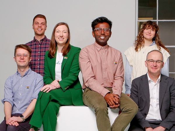 A group of people seated and standing