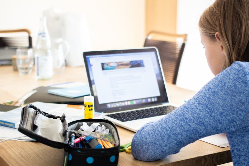 Image of Girl, Laptop and School Supplies.