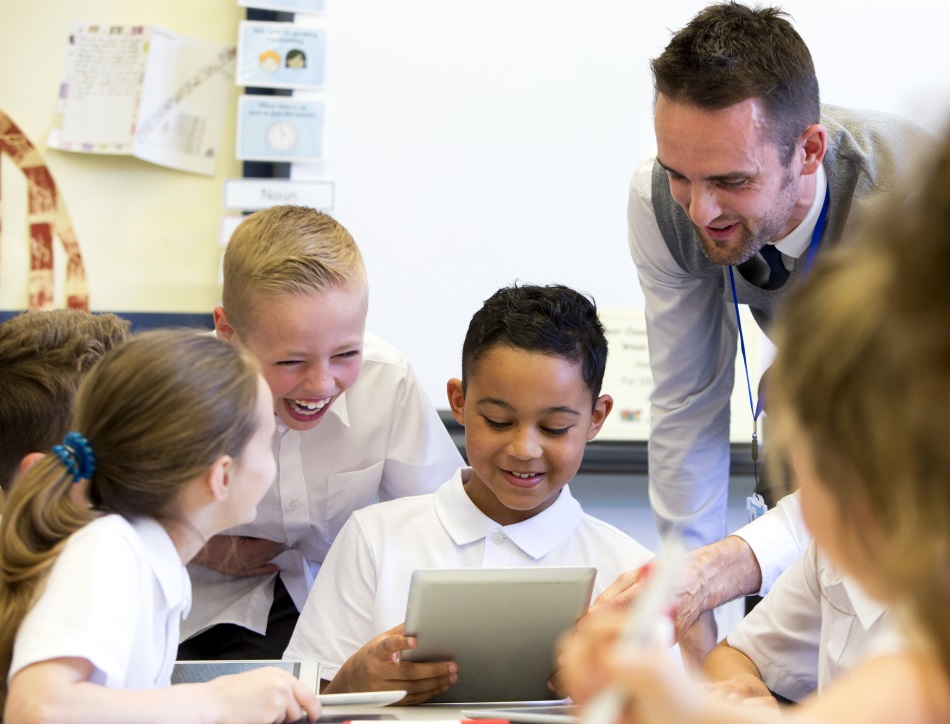 Teacher happy at school ® DGLimages_iStock_70026525